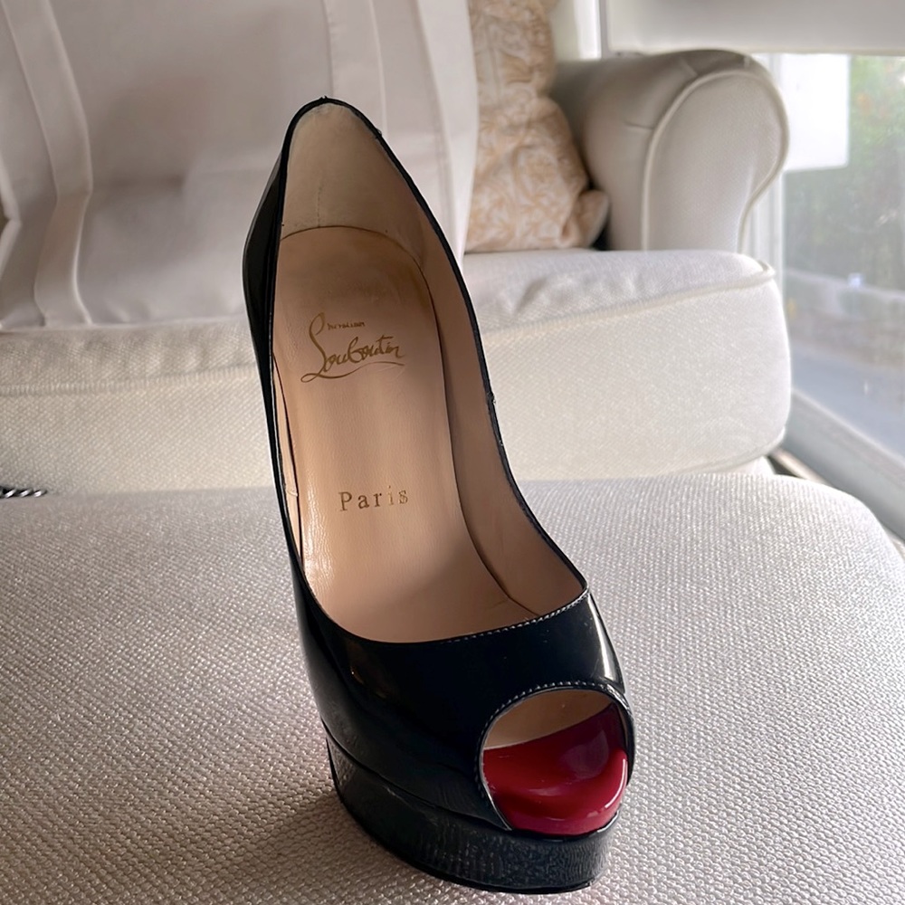 Christian Louboutin Paris black paltform shoes.